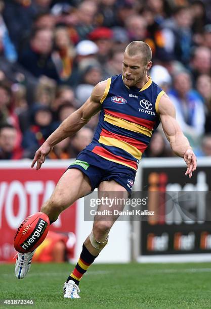 Scott Thompson of the Crows kicks the ball during the round 17 AFL match between the Adelaide Crows and the GOld COast Titans at Adelaide Oval on...