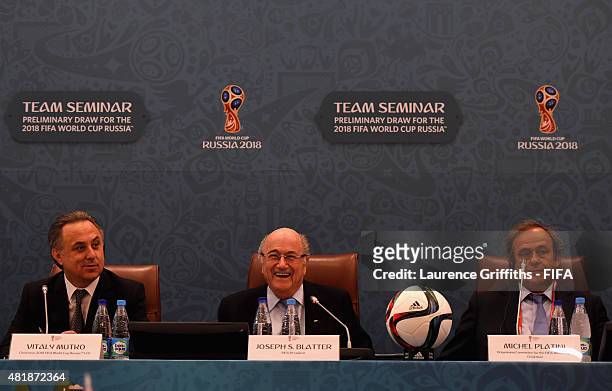 President Joseph S. Blatter smiles as Vitaly Mutko Chairman of the Local Organising Committee and UEFA President Michel Platini look on during the...