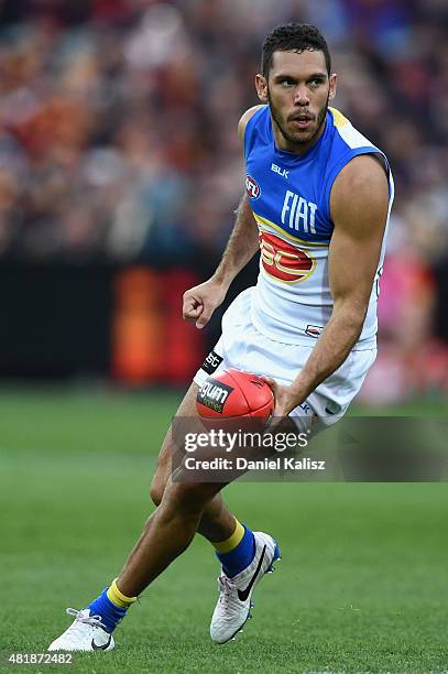 Harley Bennell of the Suns handballs during the round 17 AFL match between the Adelaide Crows and the GOld COast Titans at Adelaide Oval on July 25,...