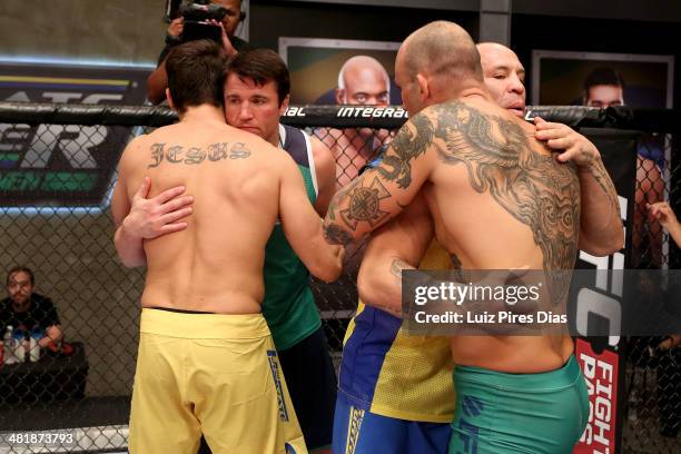 Coach Chael Sonnen and Coach Wanderlei Silva embrace opposing team fighters after Team Wanderlei fighter Antonio Carlos Junior defeated Team Sonnen...