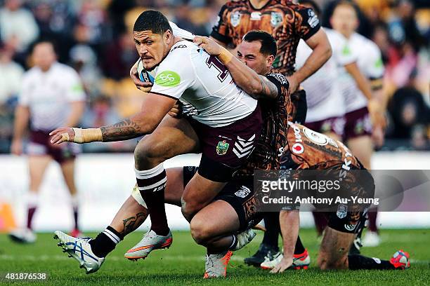 Willie Mason of the Sea Eagles charges on against Bodene Thompson of the Warriors during the round 20 NRL match between the New Zealand Warriors and...