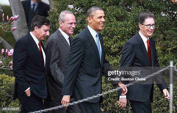 Red Sox executives Tom Werner, Larry Lucchino and John Henry arrive for the ceremony with President Barack Obama, who hosted the 2013 World Series...