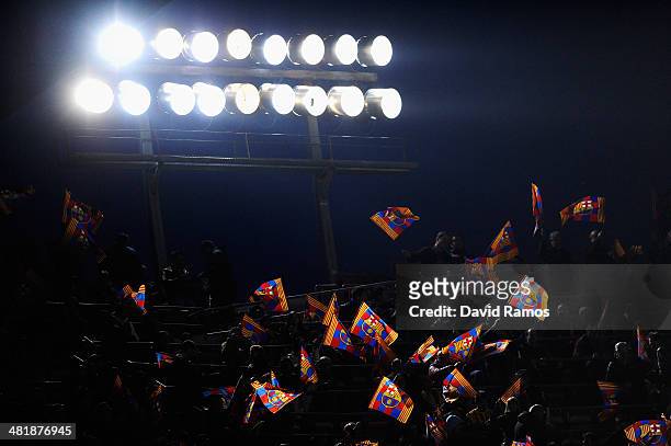 Barcelona fans wave their flags during the UEFA Champions League Quarter Final first leg match between FC Barcelona and Club Atletico de Madrid at...