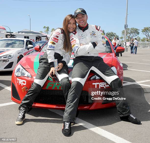 Actors Vanessa Marcil and Brett Davern arrive at press day for the 2014 Toyota Pro/Celebrity Race on April 1, 2014 in Long Beach, California.