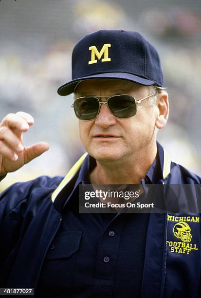 Head Coach Bo Schembechler of the Michigan Wolverines looks on while his team warms up before the start of an NCAA football game circa 1986....