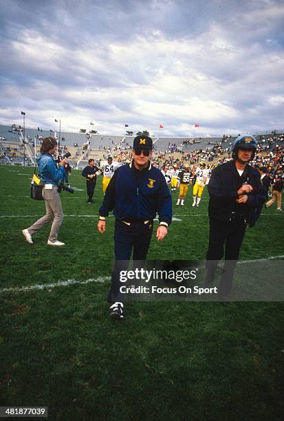 Head Coach Bo Schembechler of the Michigan Wolverines walks off the field after his team loses to the Purdue Boilermakers 31-29 in a NCAA football...