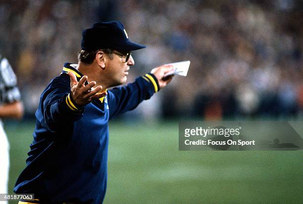 Head Coach Bo Schembechler of the Michigan Wolverines looking on from the sidelines reacts after a play during an NCAA football game circa 1975....