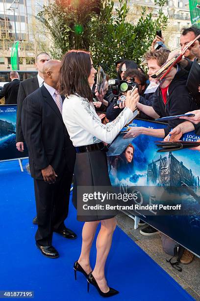 Actress Jennifer Connelly signs autographs for fans as she arrives for the Paris premiere of "Noah" directed by Darren Aronofsky at Cinema Gaumont...