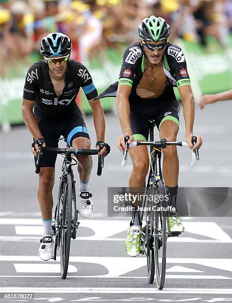 Richie Porte of Australia and Team Sky and Brice Feillu of France and Bretagne-Seche Environnement cross the finish line of stage seventeenth of the...