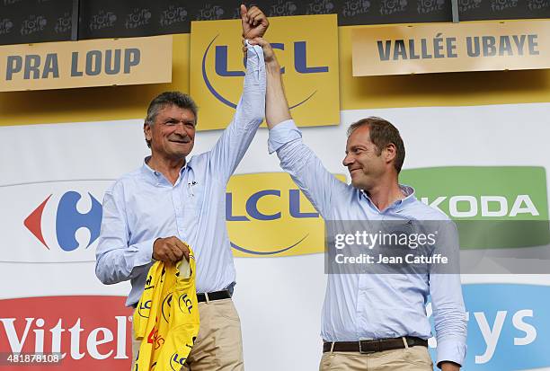 Bernard Thevenet receives from Director of Tour de France Christian Prudhomme a special yellow jersey celebrating the 40th anniversary of his victory...