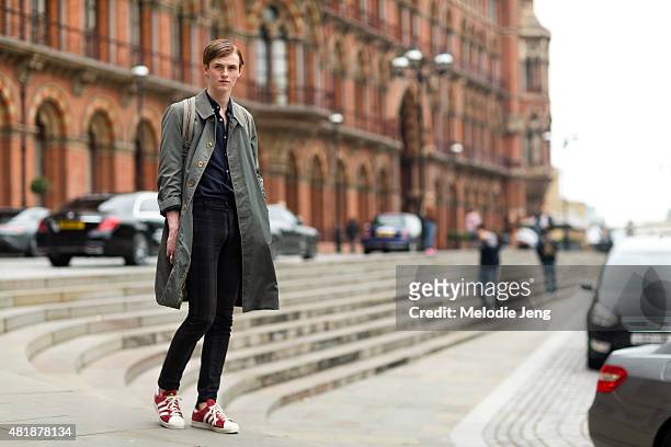 Model Fionn Creber exits the Hardy Amies show in Burberry coat, Topman pants, and Adidas original sneakers during The London Collections Men SS16 at...