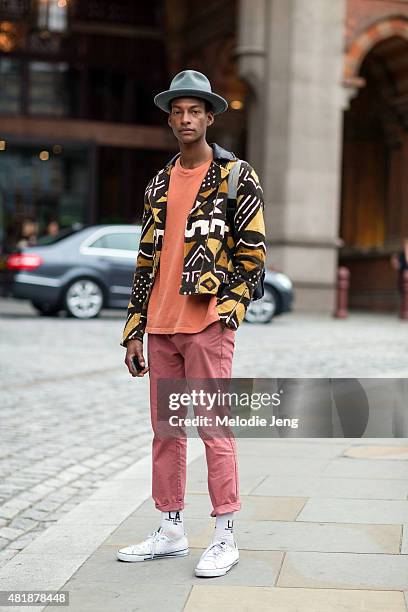 Model Ty Ogunkoya exits Hardy Amies during The London Collections Men SS16 at St. Pancras Renaissance London Hotel on June 13, 2015 in London,...