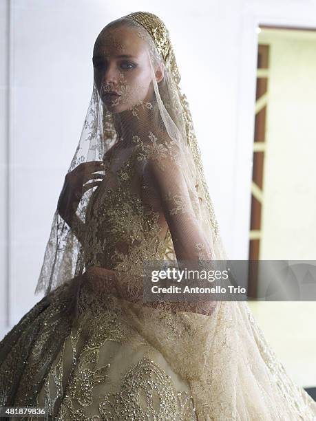 Model prepares backstage prior to Elie Saab show as part of Paris Fashion Week Haute-Couture Fall/Winter 2015/2016 at Pavillon Cambon Capucines on...