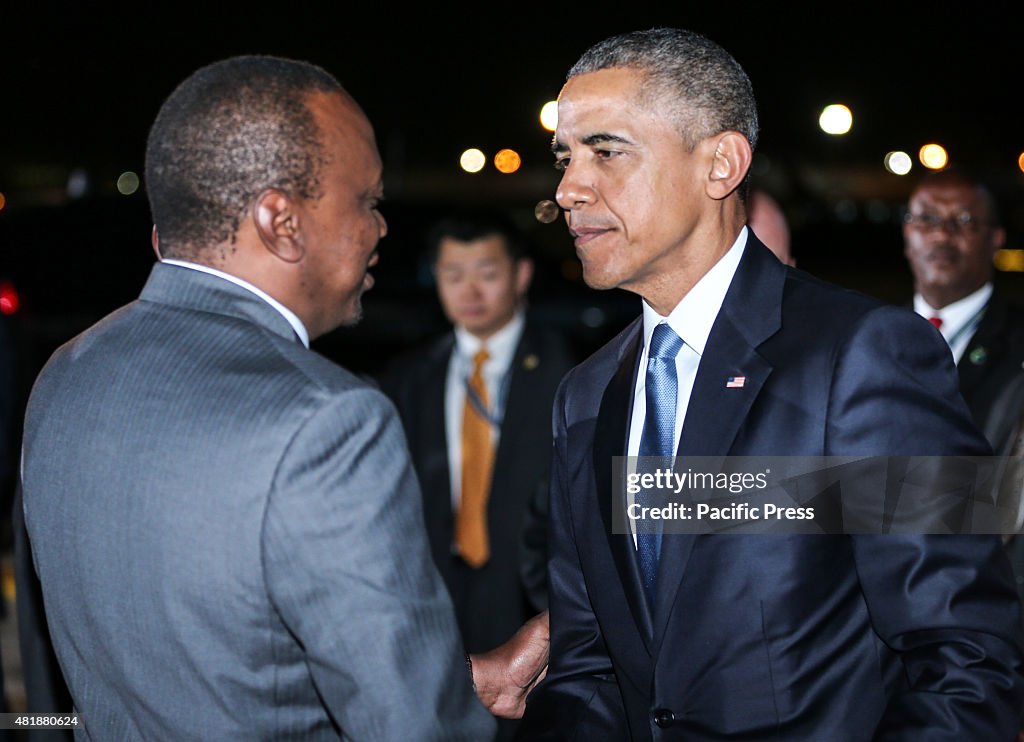 US President Barack Obama (Right) greets Kenyan President...