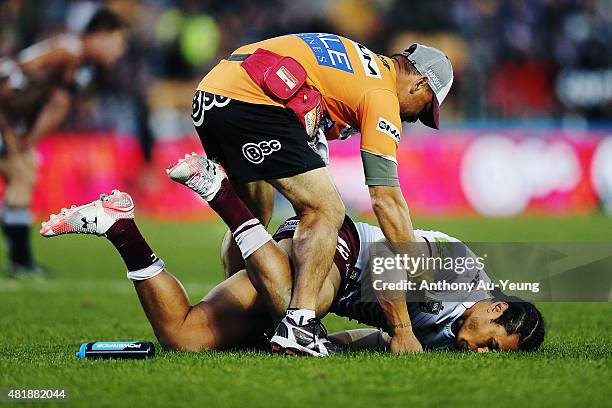 Steve Matai of the Sea Eagles falls to the ground after a head knock during the round 20 NRL match between the New Zealand Warriors and the Manly Sea...