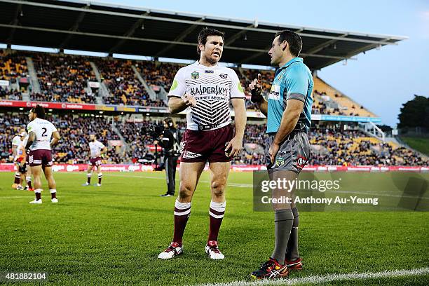 Jamie Lyon of the Sea Eagles discusses a case with Referee Gavin Reynolds during the round 20 NRL match between the New Zealand Warriors and the...