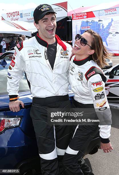 Actor Sam Witwer and actress Tricia Helfer attend the 37th Annual Toyota Pro/Celebrity Race Practice Day on April 1, 2014 in Long Beach, California.