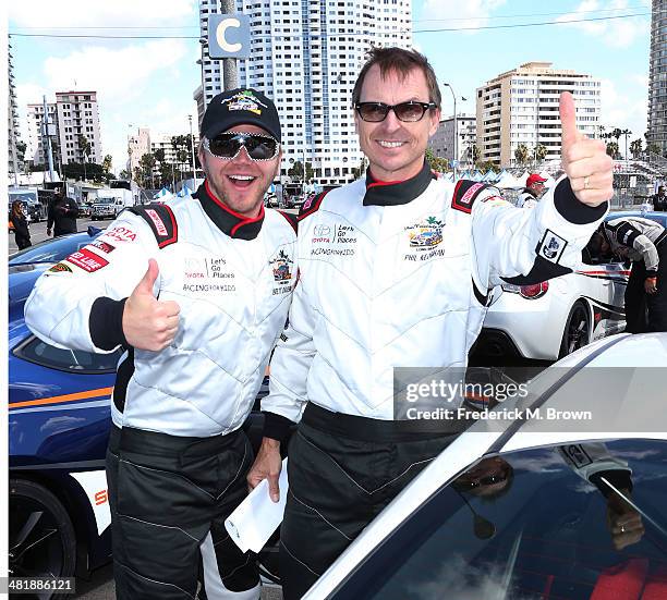 Actor Brett Davern and television personality Phil Keoghan attend the 37th Annual Toyota Pro/Celebrity Race Practice Day on April 1, 2014 in Long...