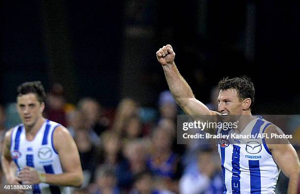 Brent Harvey of the Kangaroos celebrates after kicking a goal in his 400th AFL match during the round 17 AFL match between the Brisbane Lions and the...