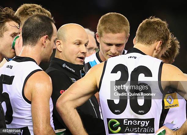 Matthew Nicks the assistant coach of the Power talks to his players during the round 17 AFL match between the Essendon Bombers and the Port Adelaide...