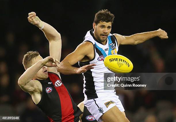Shaun McKernan of the Bombers and Patrick Ryder of the Power compete in the ruck during the round 17 AFL match between the Essendon Bombers and the...