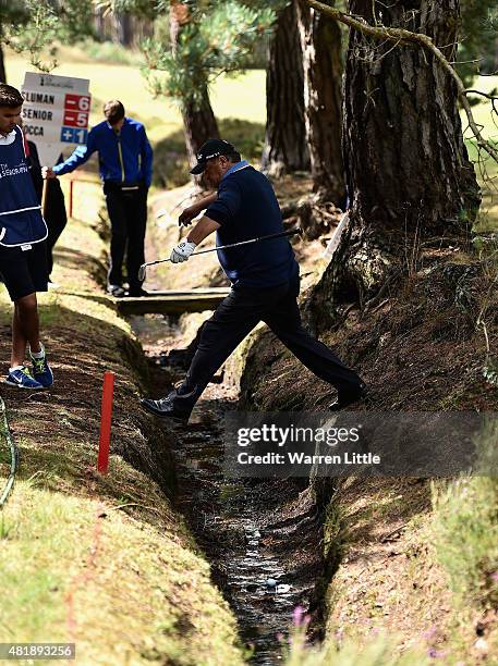 Costantino Rocca of Italy leaps over a ditch on the 11th hole during completion of the second round of The Senior Open Championship on the Old Course...