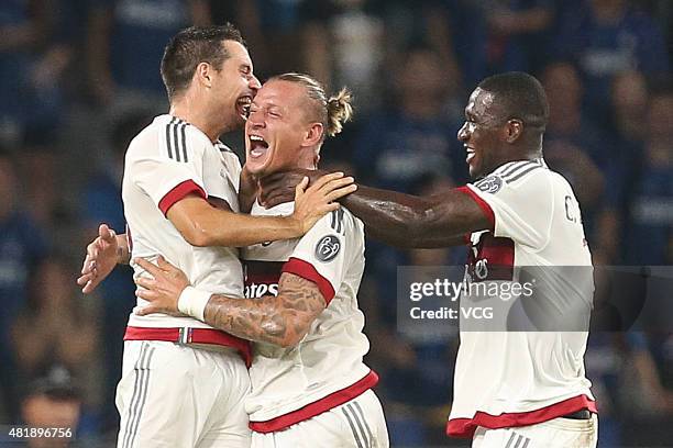 Philippe Mexes of AC Milan celebrates with team mates after scoring his team's first goal during the International Champions Cup match between AC...