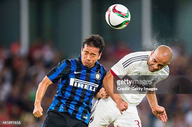 Yuto Nagatomo of FC Internazionale Milano competes for the ball with Alex Rodrigo Dias da Costa of AC Milan during the AC Milan vs FC Internacionale...