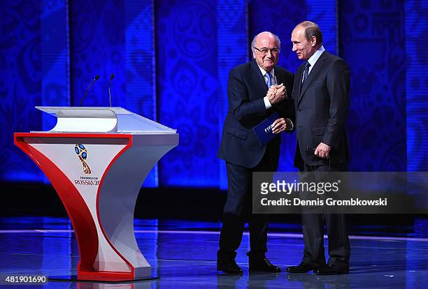 President Joseph S. Blatter shakes hands with Vladimir Putin, President of Russia during the Preliminary Draw of the 2018 FIFA World Cup in Russia at...