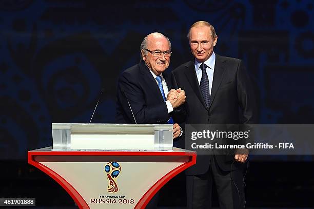 President Joseph S. Blatter shakes hands with Vladimir Putin, President of Russia during the Preliminary Draw of the 2018 FIFA World Cup in Russia at...