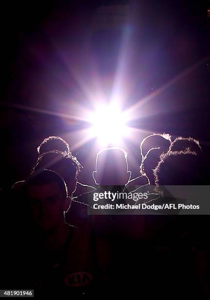 Bombers players walk out at half time during the round 17 AFL match between the Essendon Bombers and the Port Adelaide Power at Etihad Stadium on...