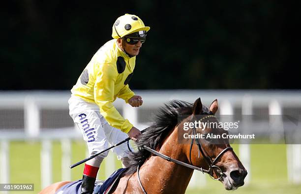 Andrea Atzeni riding Postponed celebrate winning The King George VI And Queen Elizabeth Stakes at Ascot racecourse on July 25, 2015 in Ascot, England.
