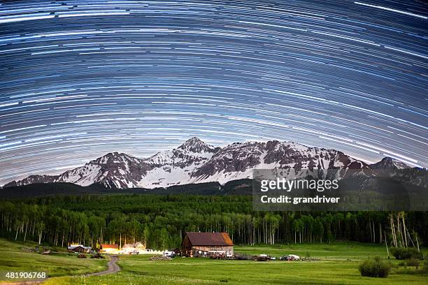 historic colorado schmid ranch at night with star trails - mt wilson colorado stock pictures, royalty-free photos & images
