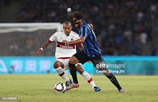Saphir Taider of FC Internazionale in action with Dias Da Costa Alex Rodrigo of AC Milan during International Champions Cup China 2015 between AC...