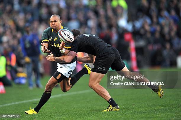 South Africa's full-back Cornal Hendricks is tackled by a New Zealand player during their test match in Johannesburg on July 25, 2015. AFP...