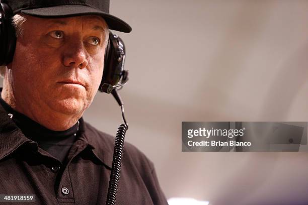 Umpire Brian Gorman dons a headset to review an MLB replay to determine if a hit by Colby Rasmus of the Toronto Blue Jays was fair or foul during the...