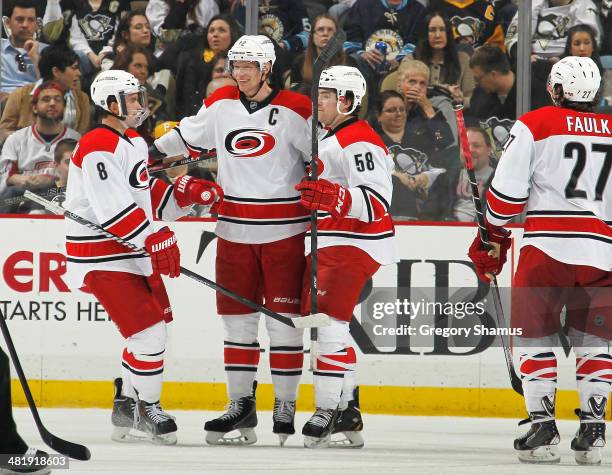 Eric Staal of the Carolina Hurricanes celebrates his goal with Andrei Loktionov and Chris Terry during the third period against the Pittsburgh...