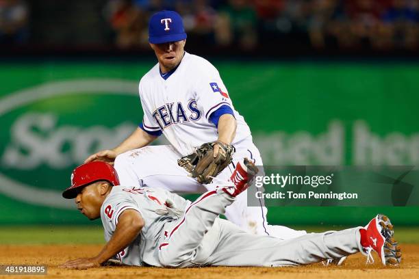 Donnie Murphy of the Texas Rangers tags out Ben Revere of the Philadelphia Phillies at second base in the top of the sixth inning at Globe Life Park...