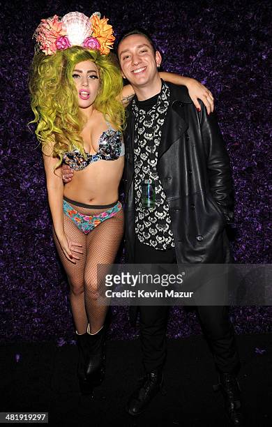 Lady Gaga and Oliver Sim of The XX backstage at Roseland Ballroom on March 30, 2014 in New York City.