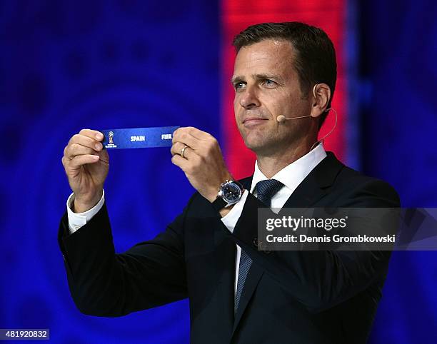 Draw assistant Oliver Bierhoff holds up the name Spain during the European Zone draw at the Preliminary Draw of the 2018 FIFA World Cup in Russia at...