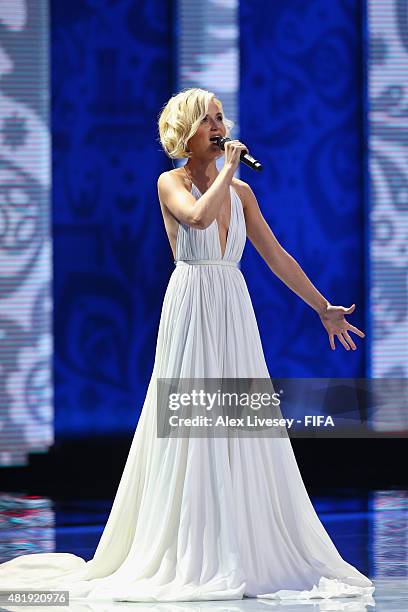 Singer Polina Gagarina performs at the Preliminary Draw of the 2018 FIFA World Cup in Russia at The Konstantin Palace on July 25, 2015 in Saint...