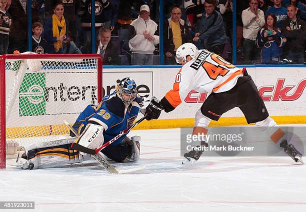 Ryan Miller of the St. Louis Blues makes a save on a point blank shot from Vincent Lecavalier of the Philadelphia Flyers during the shootout in an...