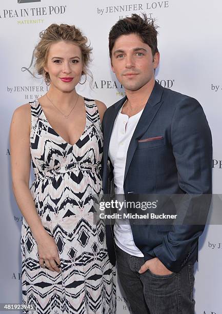 Actress Linsey Godfrey and acotr Robert Adamson arrives at the Launches of Jennifer Love Hewitt's new maternity line, "L by Jennifer Love Hewitt" at...