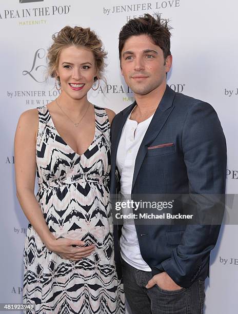 Actress Linsey Godfrey and acotr Robert Adamson arrives at the Launches of Jennifer Love Hewitt's new maternity line, "L by Jennifer Love Hewitt" at...