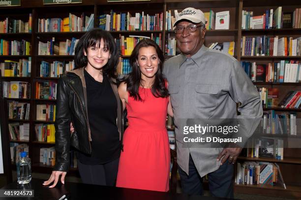 Author Yvette Manessis Corporon poses with Hilaria Baldwin and John Amos while promoting her book "When the Cypress Whispers" at Barnes & Noble 82nd...