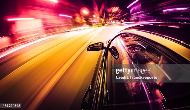 crazy ride on the night by car - fast stockfoto's en -beelden