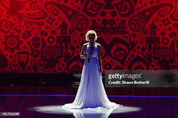 Singer Polina Gagarina performs at the Preliminary Draw of the 2018 FIFA World Cup in Russia at The Konstantin Palace on July 25, 2015 in Saint...