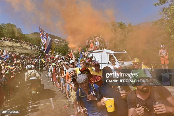 Supporters wait for riders along the road at the Dutch corner during the 110,5 km twentieth stage of the 102nd edition of the Tour de France cycling...