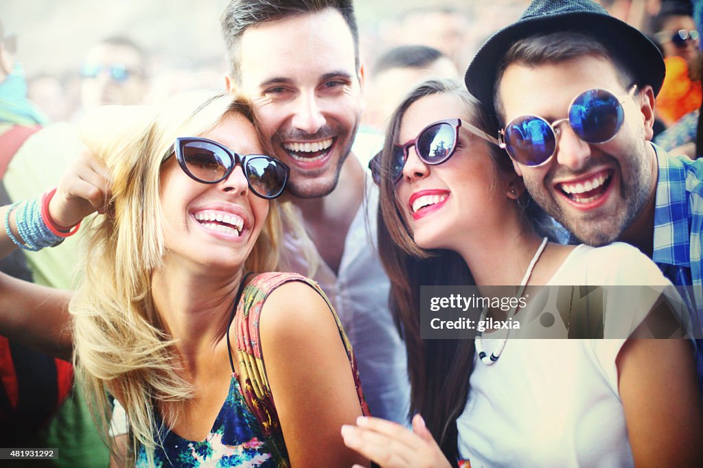 Young people having fun at concert.