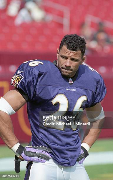 Corner Back Rod Woodson of the Baltimore Ravens stretches on the field before a NFL football game against the Washington Redskins at FedExField on...